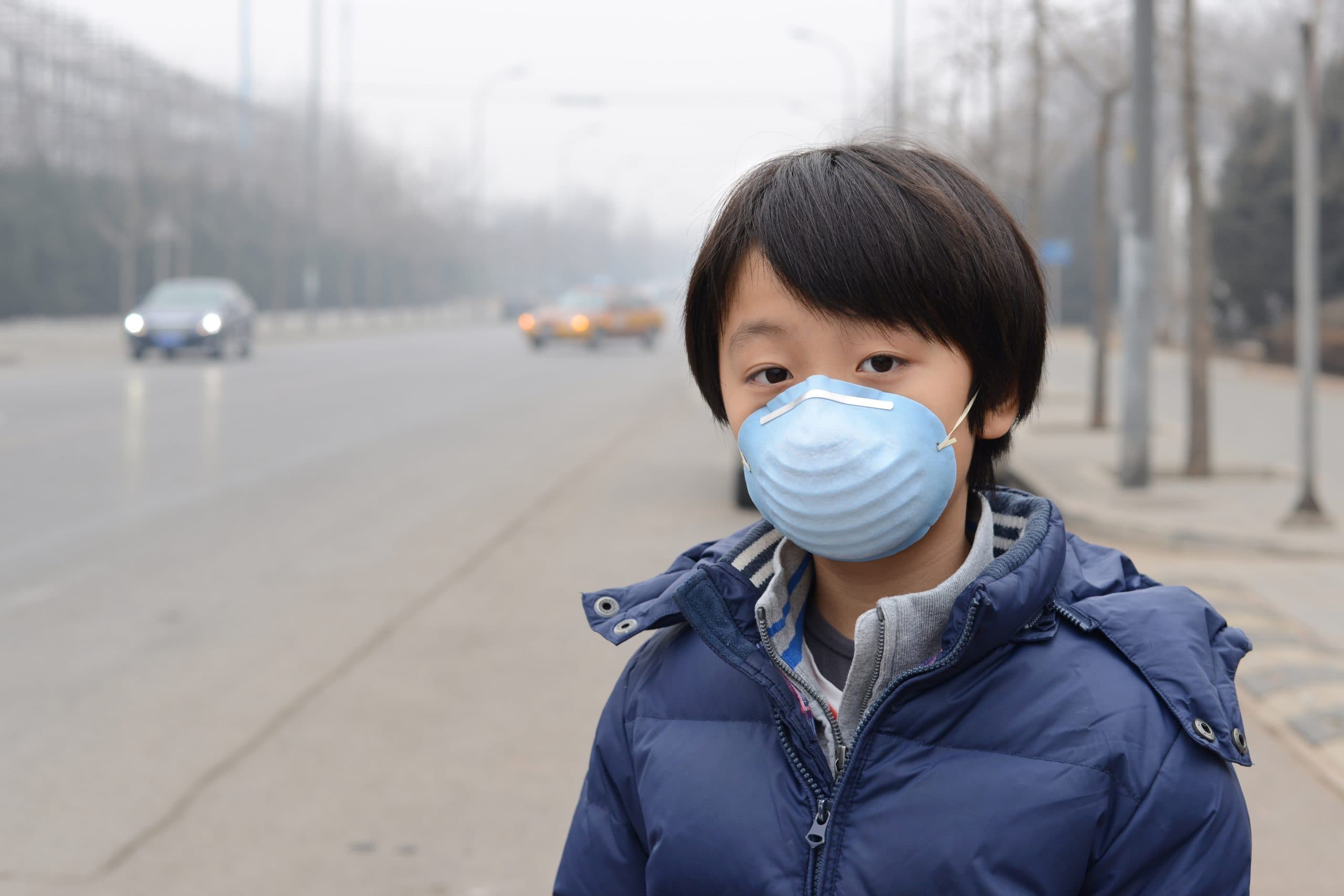 Child wearing mask outside